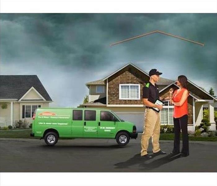 SERVPRO - image of technician and customer in front of home