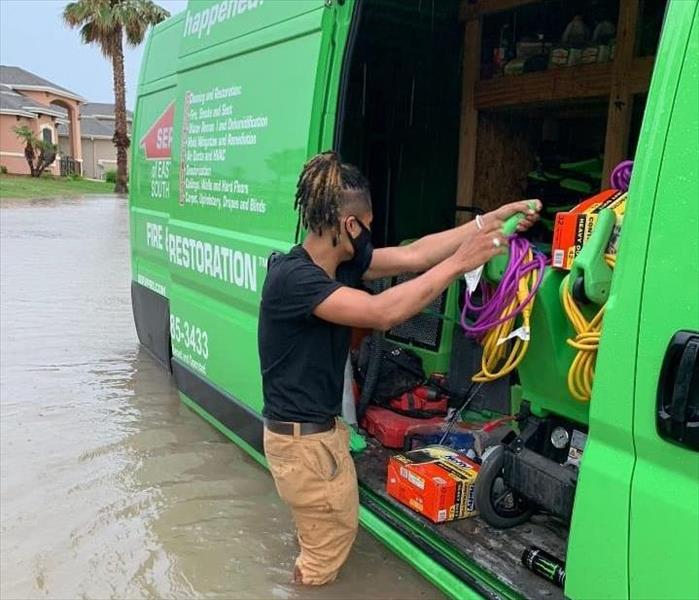 SERVPRO to the rescue! Image of green SERVPRO vehicle.